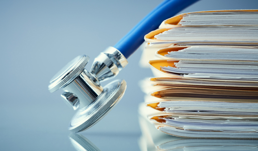 stethoscope leaning against files