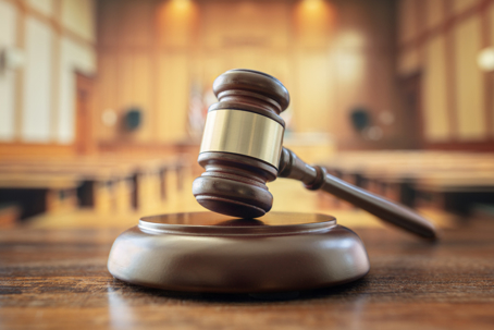 Judges gavel in court room legal trial and law background
