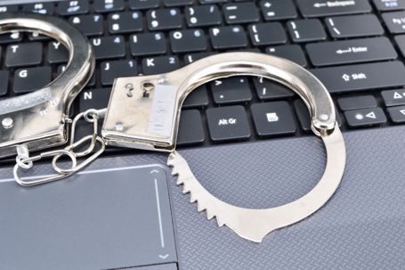 handcuffs on keyboard