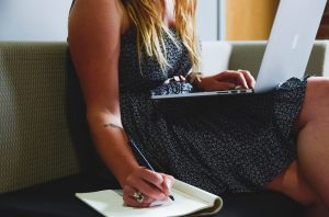 woman holding laptop