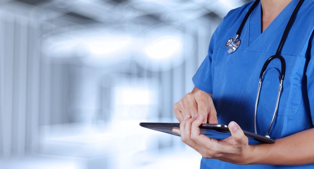 Hospital staff with pen and chart