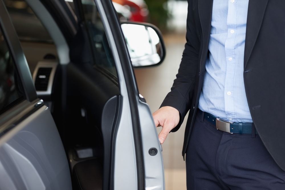 man holding the car door