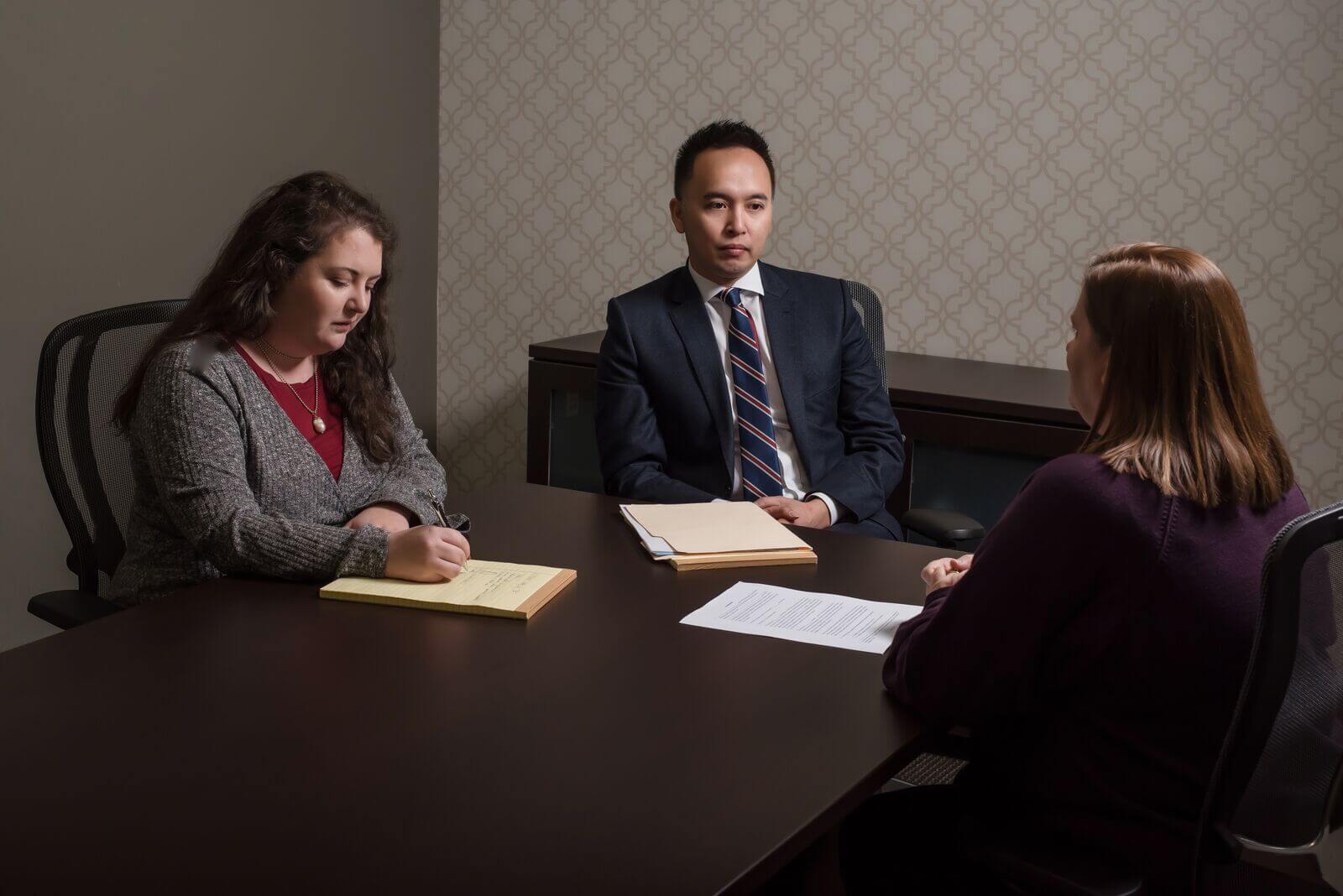 Three people in meeting