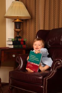 baby holding a book