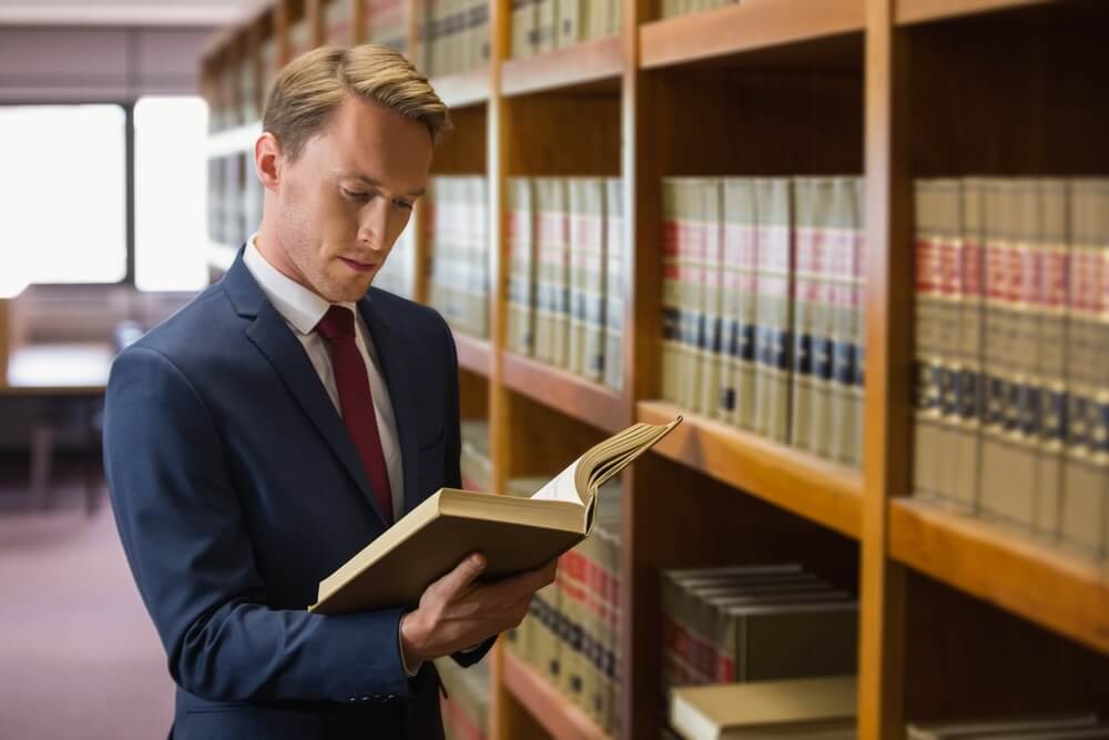 Lawyer reading a case book