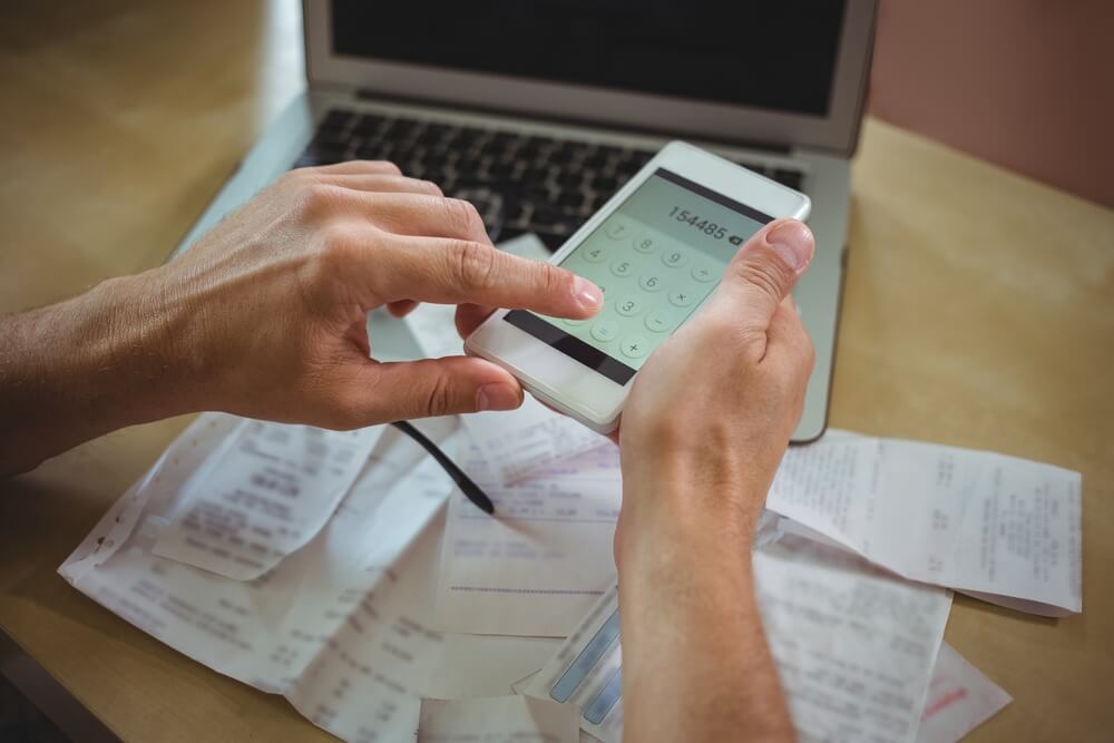 Man calculating bills