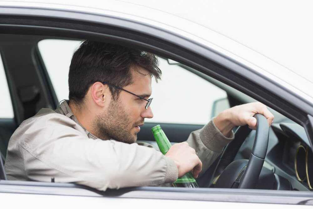 Man drinking while driving