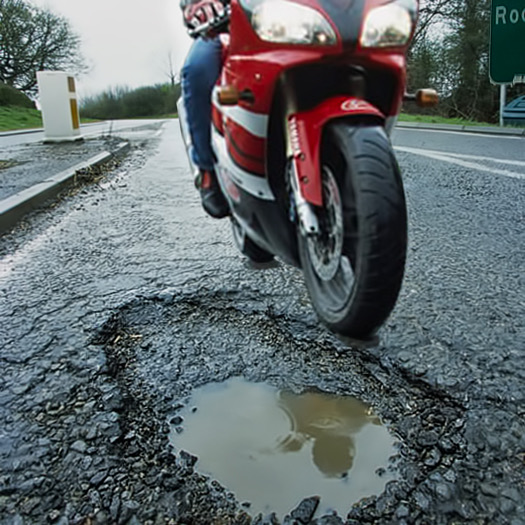 motorcycle and pothole