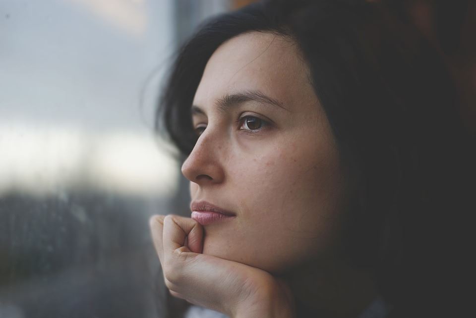 Woman looking out a window