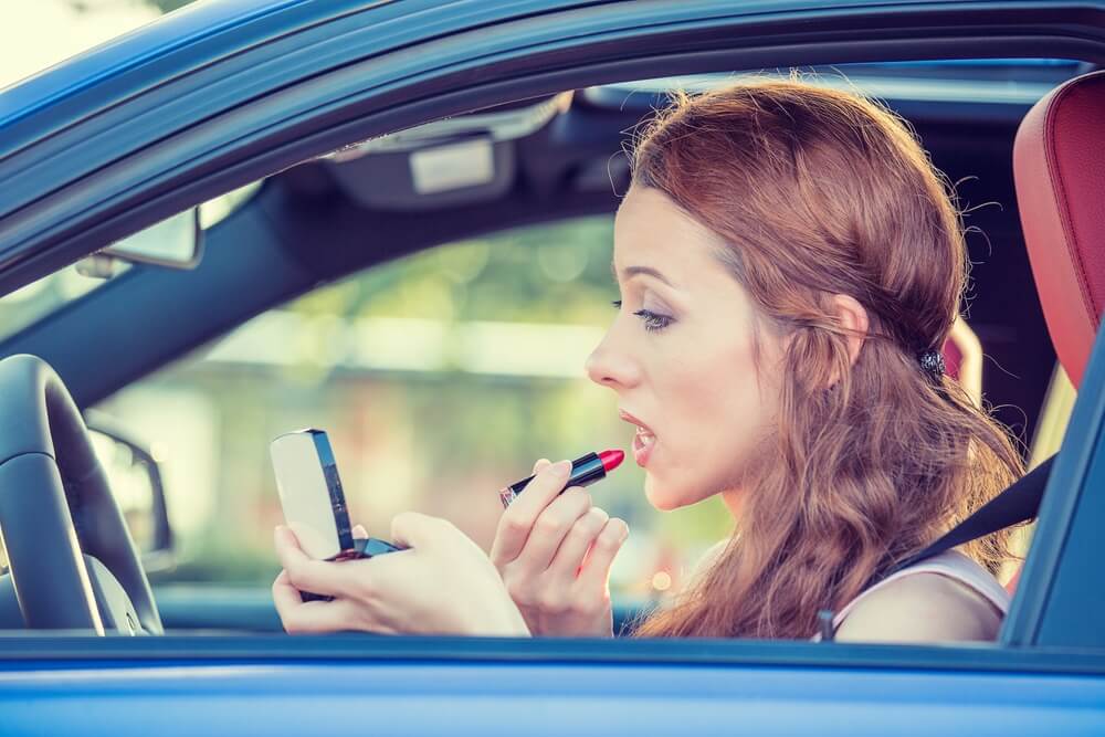 Woman applying makeup